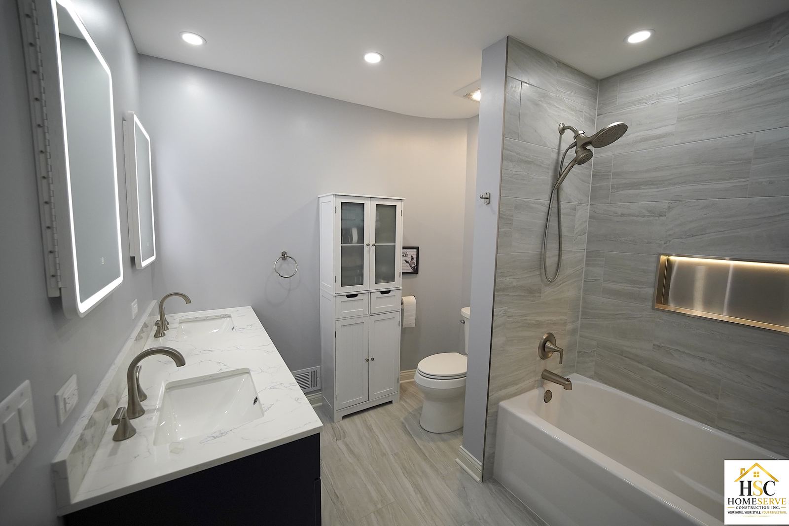 Gurnee bathroom after - double vanity, toilet nook, and shower entry