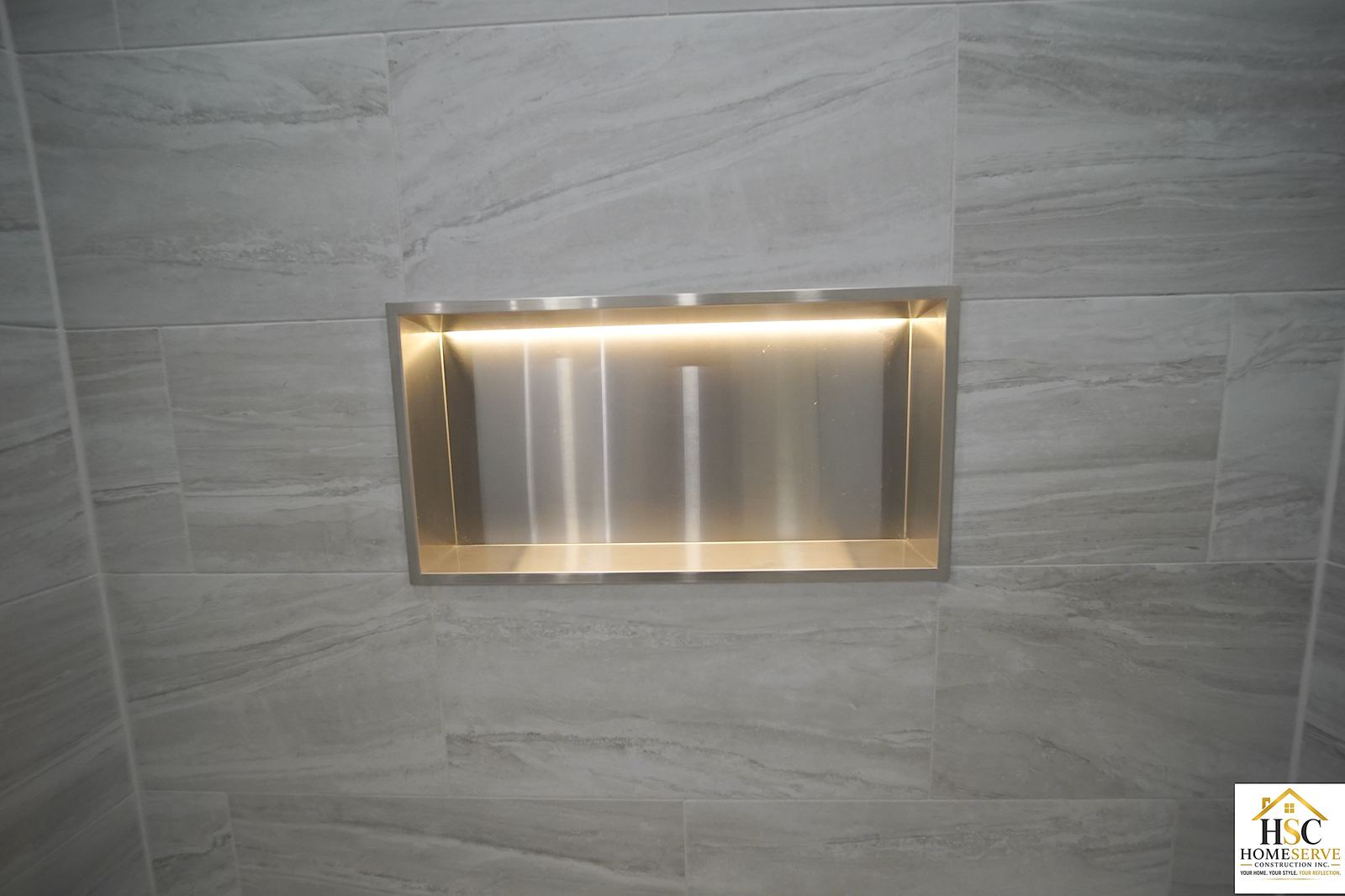 Gurnee bathroom after - stainless shower niche close-up