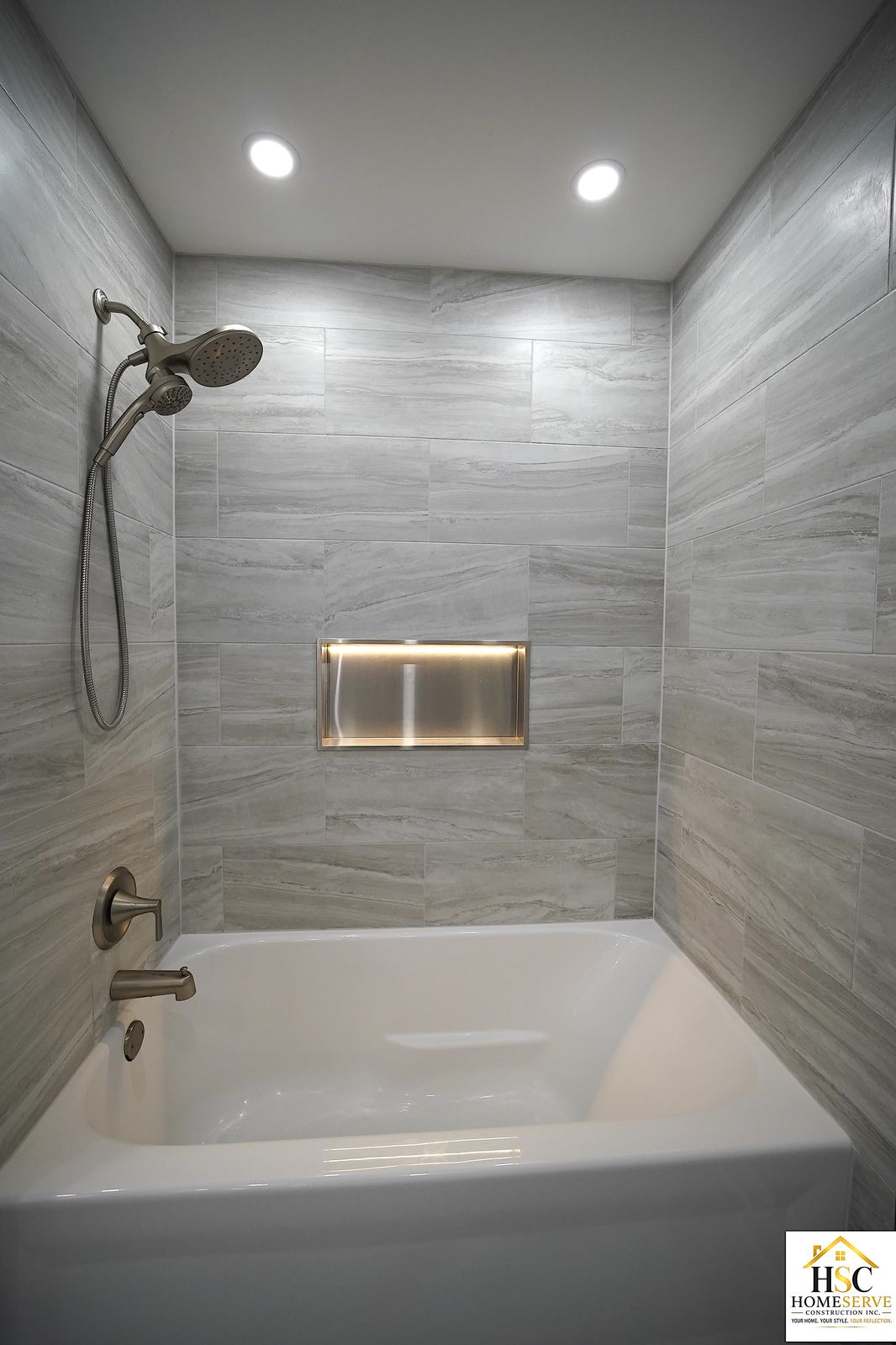 Gurnee bathroom after - tub and stainless shower niche