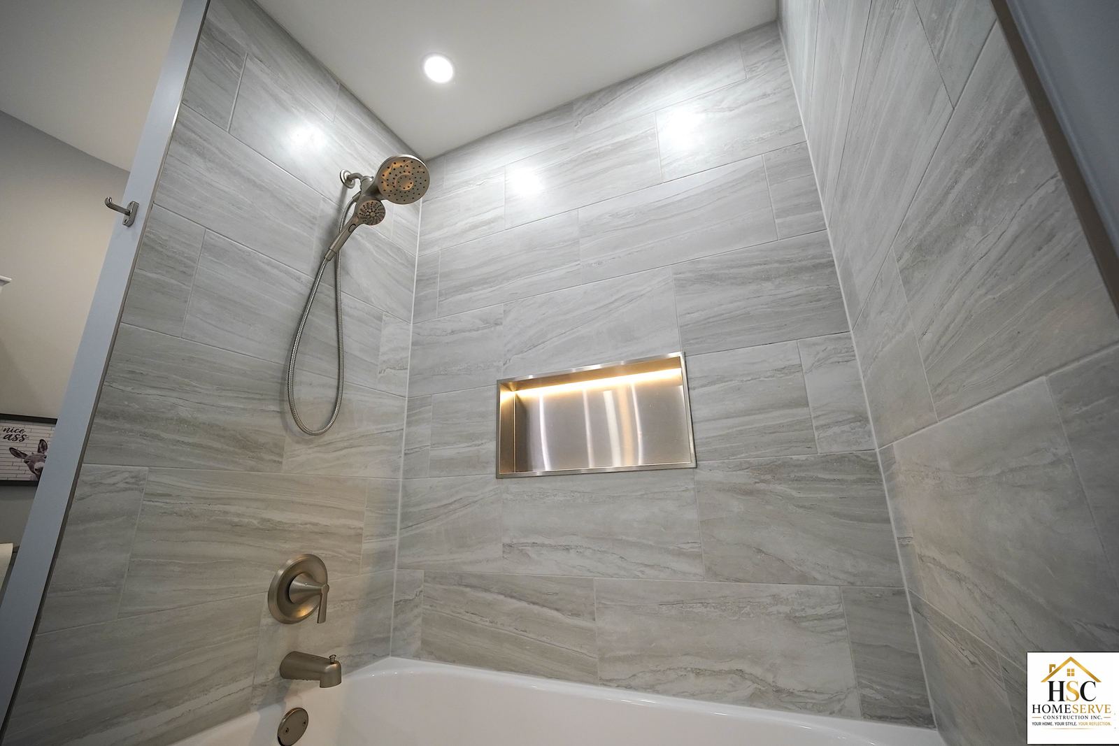 Gurnee bathroom - finished tiled tub surround with lit stainless niche
