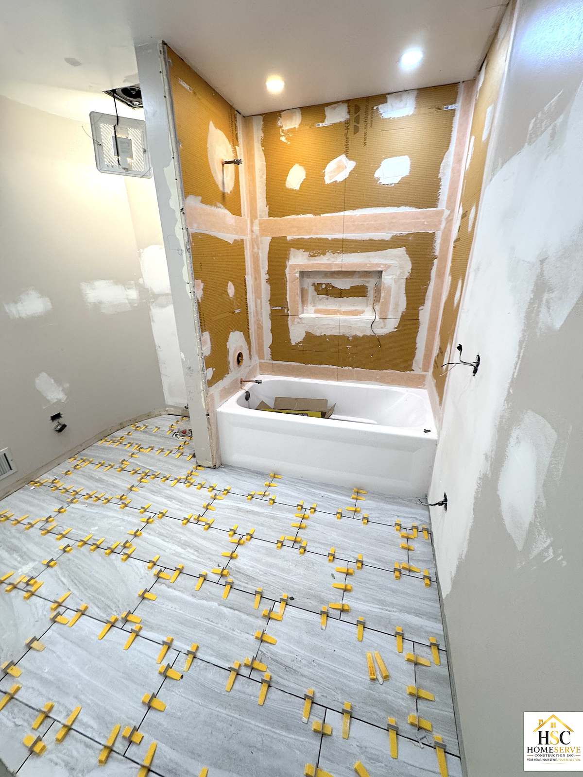 Gurnee bathroom - floor tile going in with waterproofed shower walls