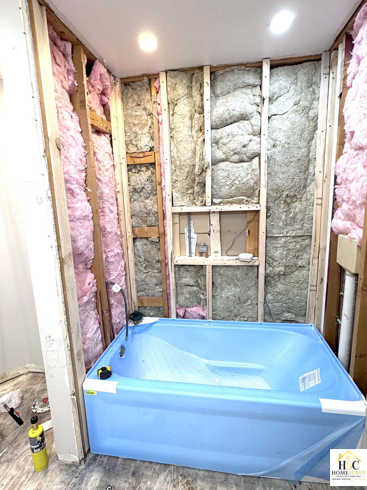 Gurnee bathroom - new tub set with framing and insulation exposed