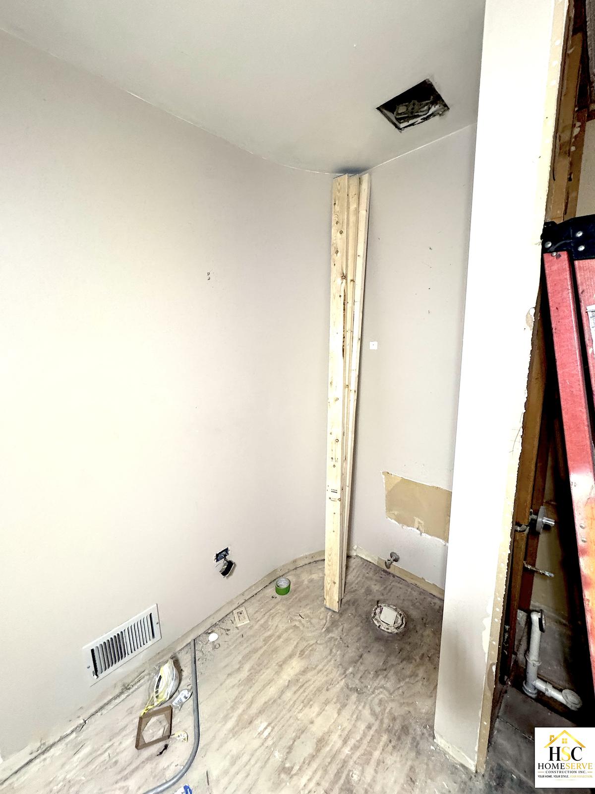 Gurnee bathroom - toilet nook stripped to subfloor