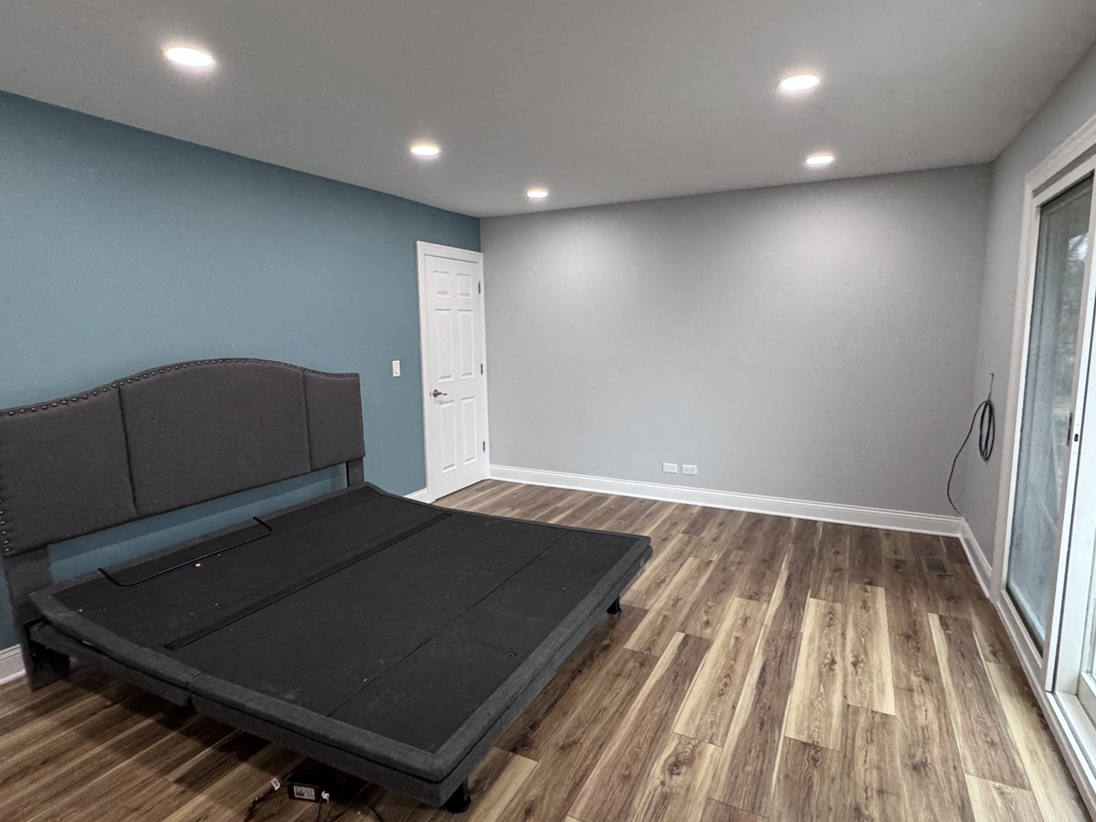 Hanover Park bedroom after: gray walls and patio door