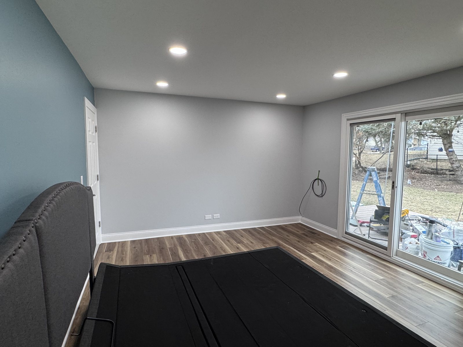 Hanover Park bedroom after: wide view with patio door