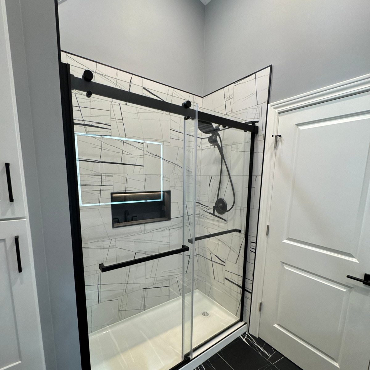 Sliding glass door with black-line tile