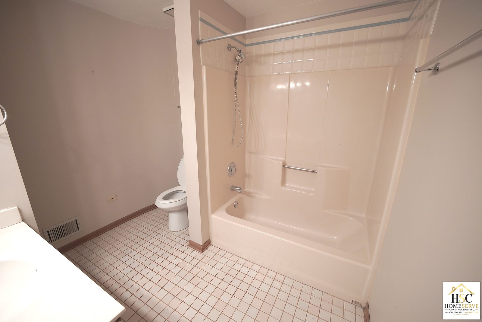 Original bathroom with tub, toilet, and tile floor