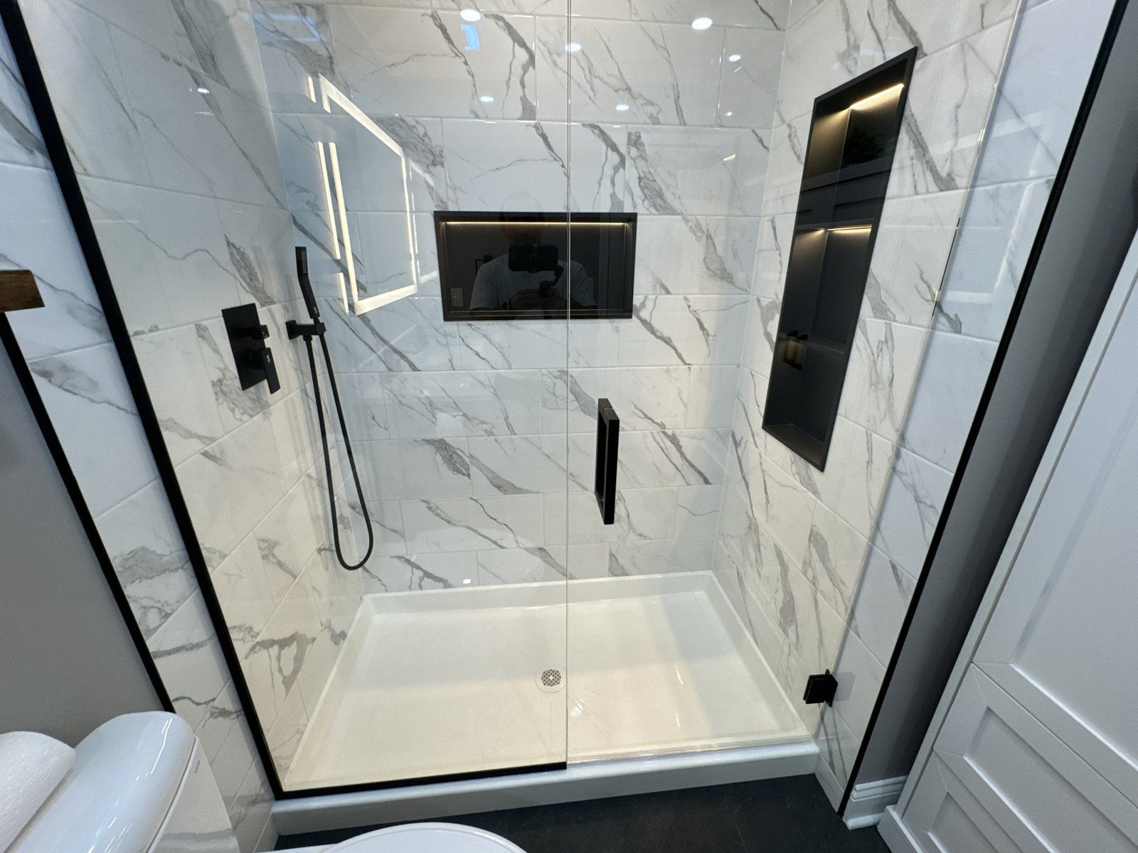 Finished master bathroom with freestanding tub and tiled shower