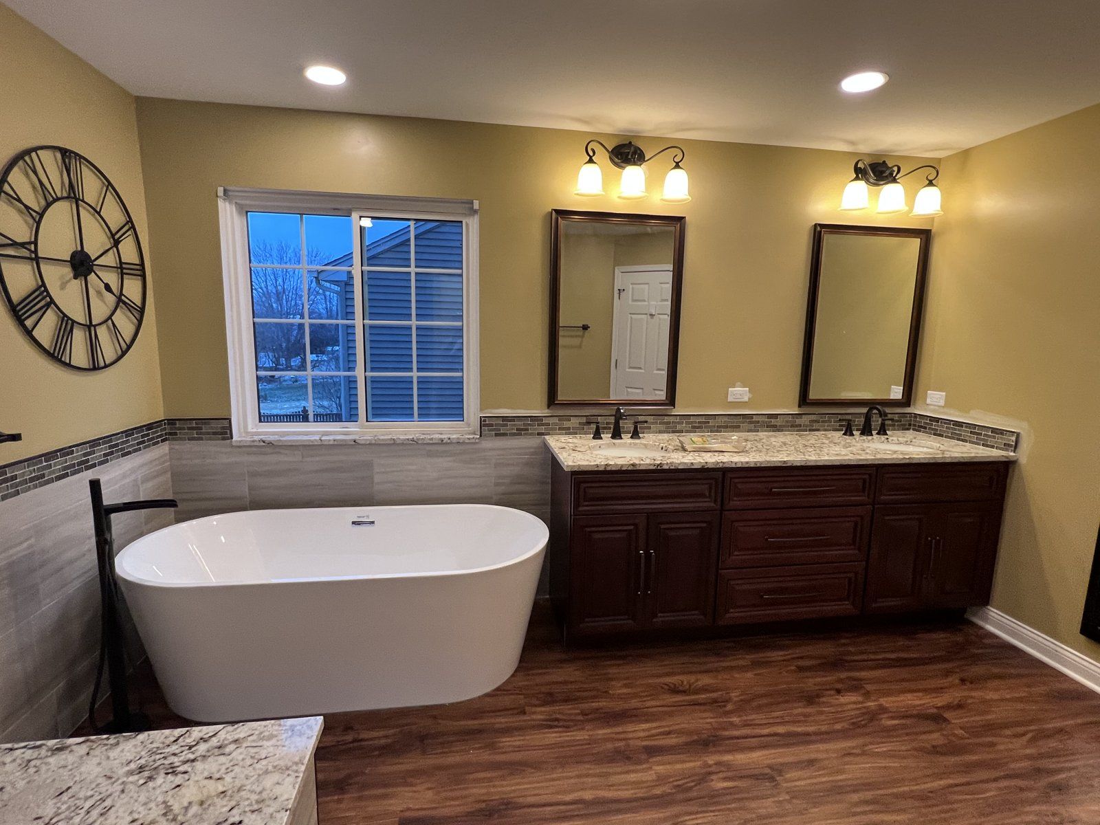 Primary bathroom with freestanding tub, walk-in shower and double vanity