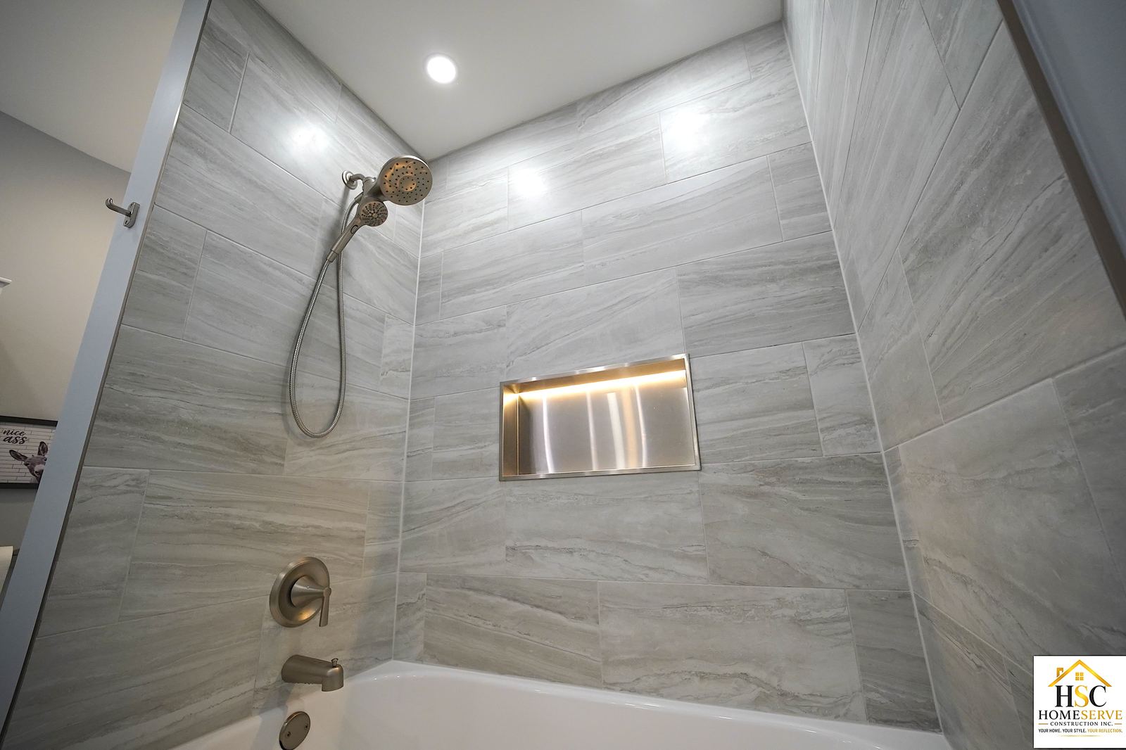 Gurnee, IL bathroom after - tiled tub surround with lit stainless niche